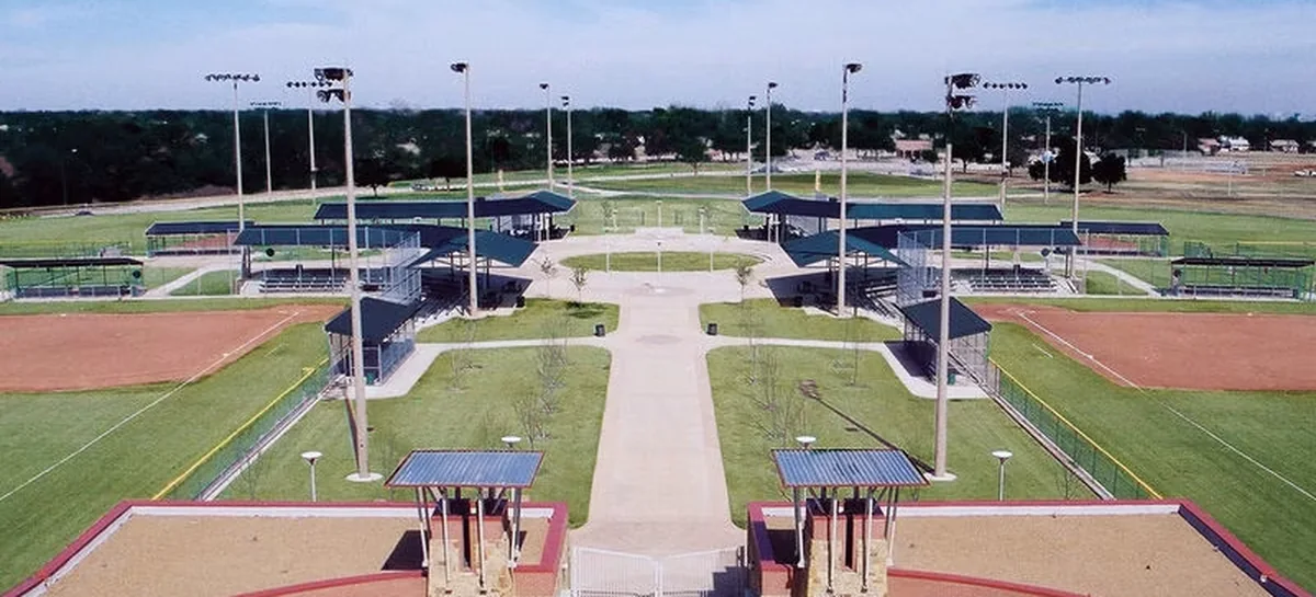 The ball fields, covered stands and entry plaza at Kiest Park from the air.