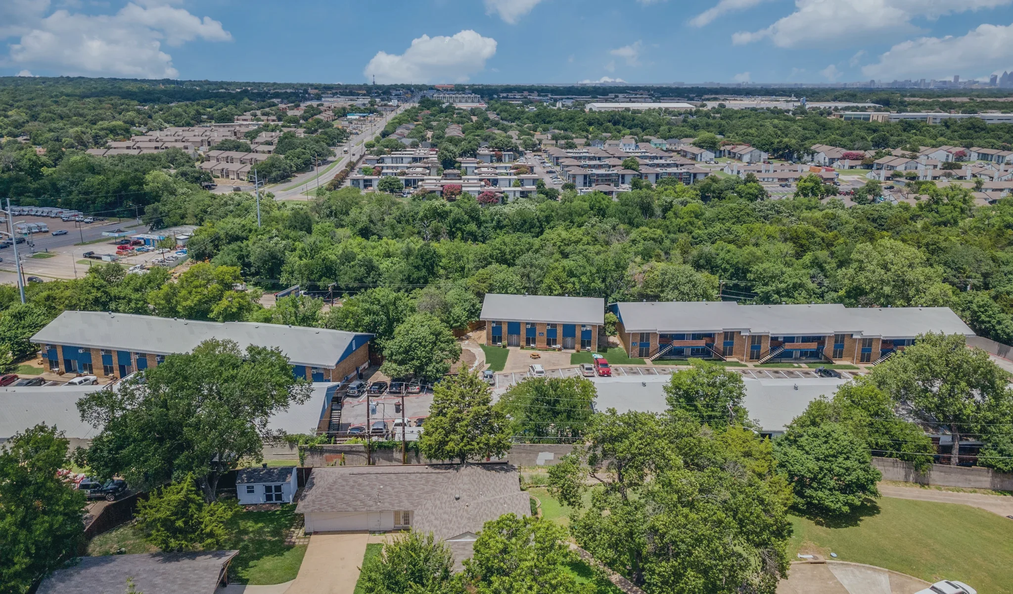 The road running out of the neighborhood from above, with the property in the foreground.